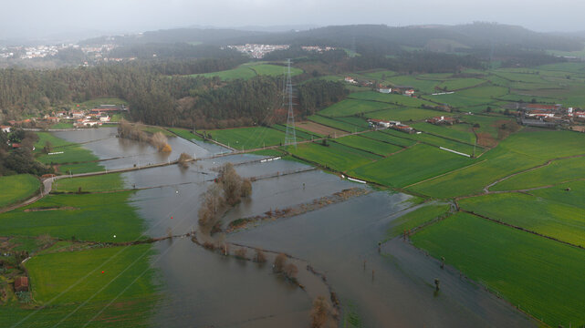 Aerial shot of river flooding agricultural land. Nutrient cycle. 