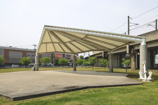 Chiganoura Ryokuchi Park riverside with fields and urban outskirts