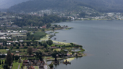Fototapeta premium Aerial view of Beratan Lake with view of Pura Ulun Danu Beratan, a famous temple in Bedugul, Bali, Indonesia