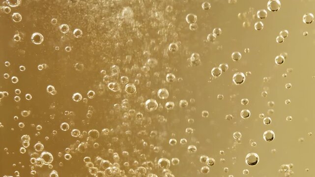 Thousands of Effervescent Champagne Bubbles Rising Rapidly in Golden Liquid, Luxury Celebration Background 1080p