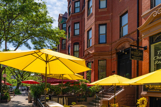Boston, MA, US-May 26, 2026:  Ourdoor restaurant with yellow umbrellas in summer along Newbury Street in the Back Bay neighborhood.