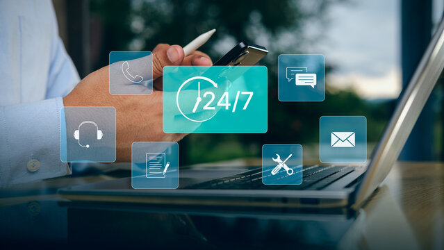 Business Professional Using Smartphone and Laptop with 24 7 Customer Support Interface Digital Communication Help Desk Contact Center Omnichannel Service and Remote Technical Assistance Concept