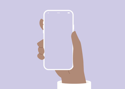 In a modern setting, a hand confidently grips a stylish handheld device with a blank screen, embodying the intersection of design and technology on a gentle grey backdrop.