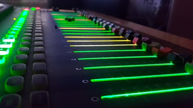 Audio mixer fader moving up and down during sound mixing