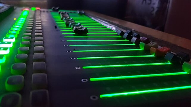 Close up of audio mixer fader in television control room