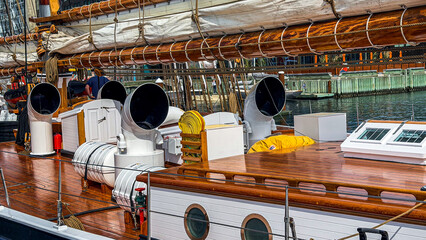Sailing vessel docked at marina with visible features in the afternoon © Creative house