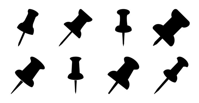 Set of black push pins on white background - Eight black push pins arranged in two rows of four, ready for use in office or organization tasks.