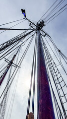 Fototapeta premium View of ship masts and rigging against the sky during the day