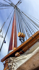 Sailing vessel mast and rigging in bright sunlight on the open water © Creative house