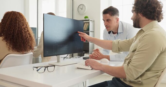 Developers team perform code review in office. Programmers work at the computer as a mentor guides debugging to improve workflow. Focused teamwork and collaboration technology concept.