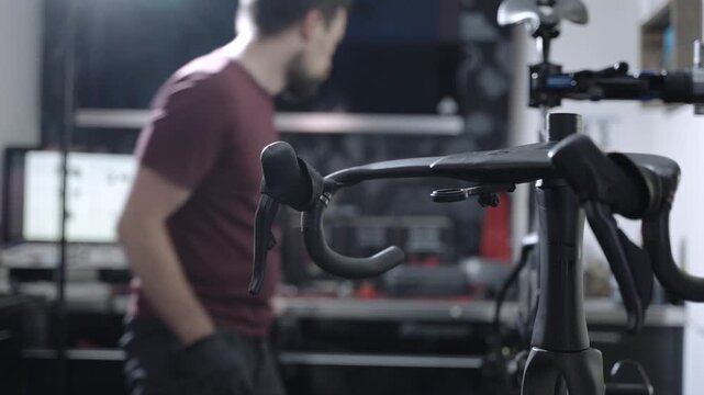 Close up video of a bicycle mechanic repairing and adjusting a bike in a workshop. Professional maintenance service with tools and technical work focused on bicycle care and cycling equipment.