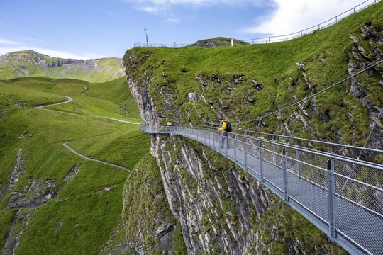 Tourist on First Cliff Walk, metal trail on a rocky outcrop, Grindelwald First, tourist attraction, Bernese Alps, Bernese Oberland, Switzerland