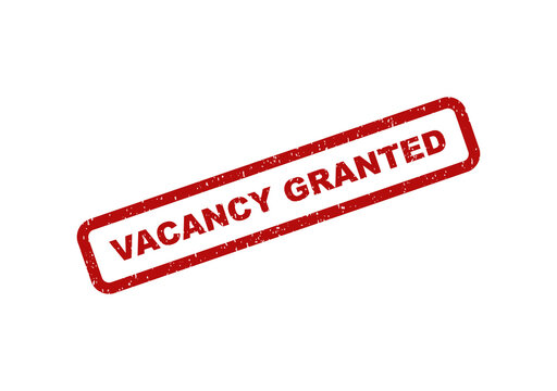 Red grunge rubber stamp with the text vacancy granted on paper