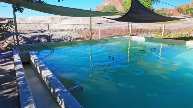 View of the public thermal pool at Hot Springs State Park in Thermopolis Wyoming with naturally heated mineral water