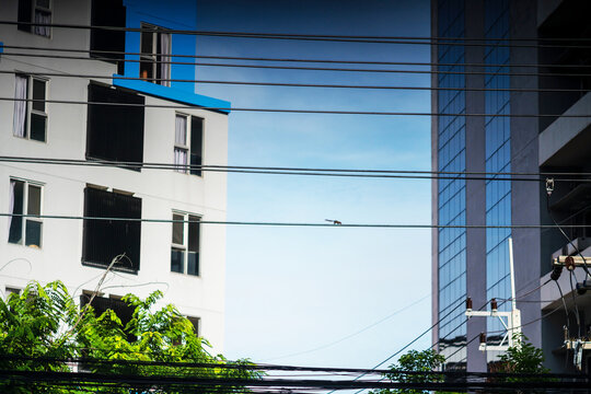 Modern urban buildings with electrical wires
