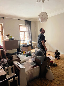Man and the child moving to another apartment