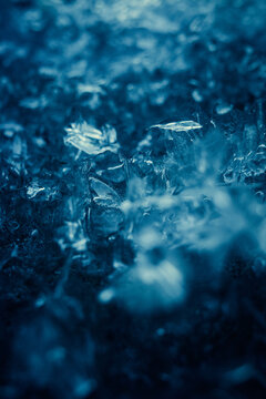 Ice crystals form on a surface during the night in winter