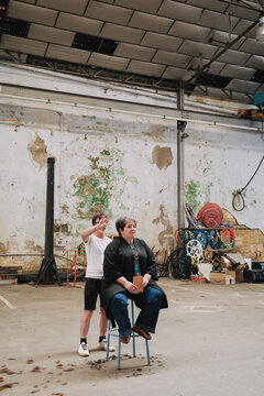 Two People in Industrial Warehouse
