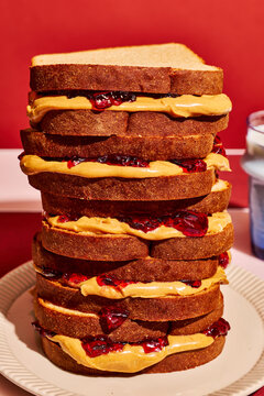 Stacked Breakfast Sandwiches on Plate With Retro Red Background