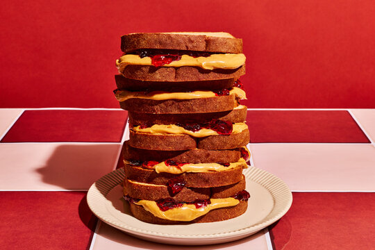 Stacked Breakfast Sandwiches on Red Checkered Table