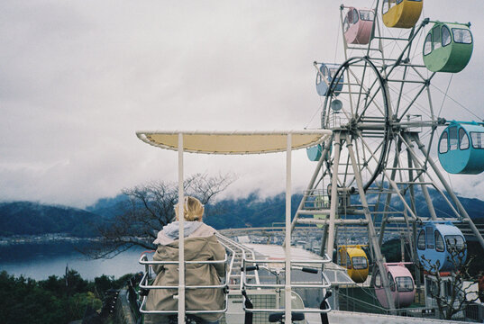 A girl riding a cycle car in Japan