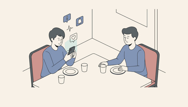 Social media addiction concept showing a man ignored by his friend who is busy looking at a smartphone during a dinner date.