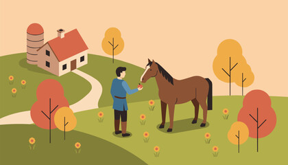 Fototapeta premium Farmer feeds a fresh red apple to his brown horse on a beautiful autumn hill near his house and silo.
