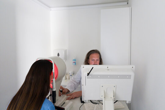 Eye Doctor Performing Examination