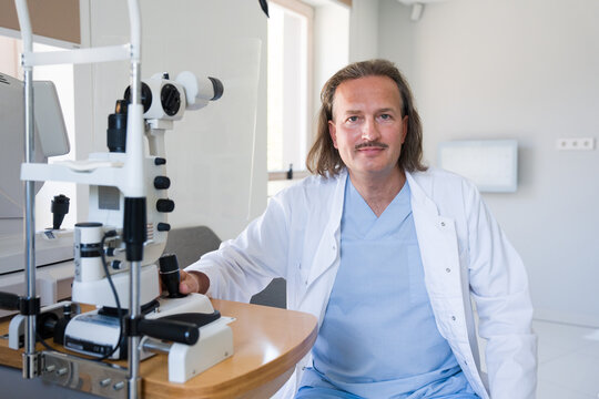 Eye Doctor in Clinic With Equipment at Work Desk