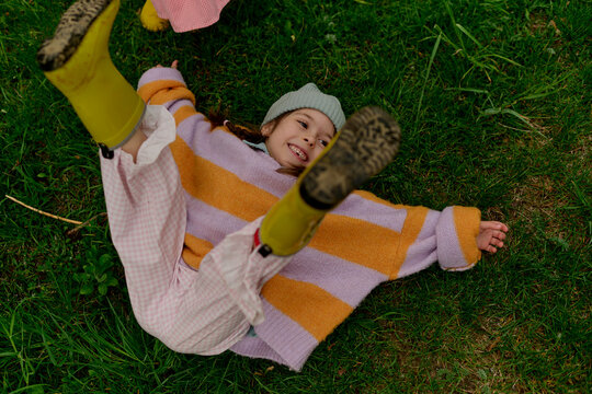 Playful Child Laughing in Tall Grass