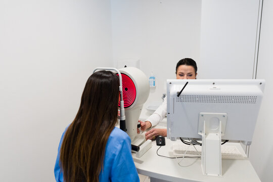 Eye Doctor Performing Examination Using Advanced Equipment