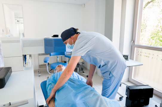 Surgeon Prepares Patient for Procedure in Clinic 