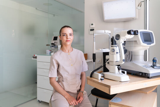 Optometrist at Work in a Modern Eye Clinic 