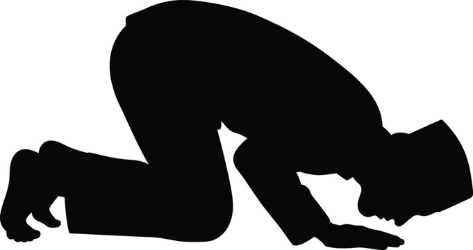 Silhouette of man performing islamic prayer ritual in sujud position wearing traditional songkok cap.