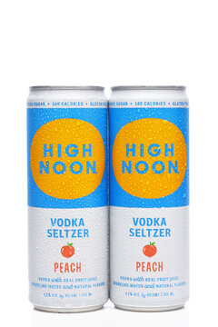 IRVINE, CALIFORNIA - 24 JUN 2026: Two cans of High Noon Vodka Seltzer Peach flavor adult beverage.