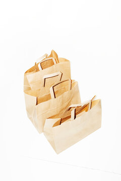 Delivery from courier of brown takeaway packages boxes in hallway