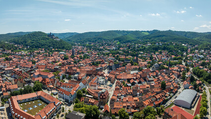 Drone aerial view of the historic old town of Wernigerode with Wernigerode Castle overlooking the city in the Harz Mountains region of Saxony-Anhalt, Germany © Raiko Goldenbaum