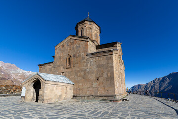 Fototapeta premium View of Gergeti Trinity Church near the village of Stepantsminda in Georgia