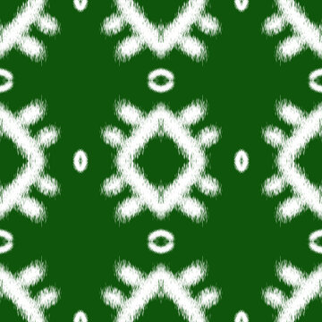 Seamless Ethnic Ikkat Pattern with White Tribal Motifs on Dark Green Background