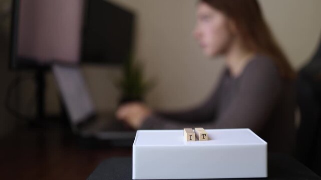 Young woman focused on remote technology work building freelance career developing digital skills and completing online projects from home workspace