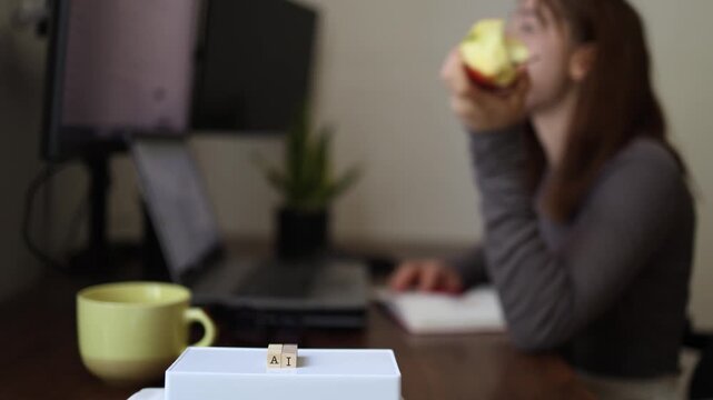 Artificial Intelligence helps developer work more efficiently while coding as programmer eats apple during productive software development and problem solving