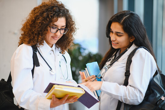 Medical students studying together in university hallway