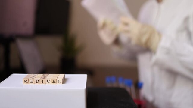 Medical researcher reviews laboratory records before analyzing patient samples preparing for biomarker testing disease screening and clinical diagnostics