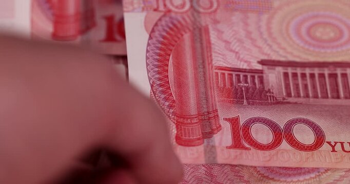 Chinese yuan with a face value of 100, a large amount of Chinese cash invested together, closeup