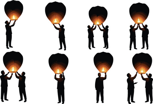 Silhouette of people releasing sky lanterns at night with glowing fire light, celebration, hope, peace, and festival tradition concept