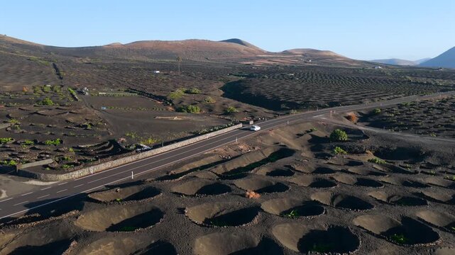 Aerial Sunset View of the Volcanic Vineyards and Ash Craters in La Geria Lanzarote