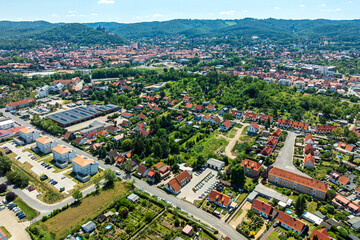 Obraz premium Drone view of Zaunwiese and Galgenberg districts with Wernigerode city center in the background, Harz Region, Saxony Anhalt, Germany