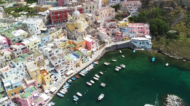 Cinematic drone view of Procida island skyline above blue