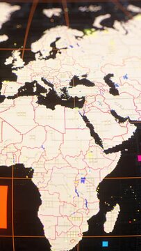 Vertical video: Panning camera moving down on vertical screen showing digital map EMEA with markers