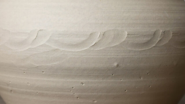 Wavy texture on a ceramic surface close up studio photograph